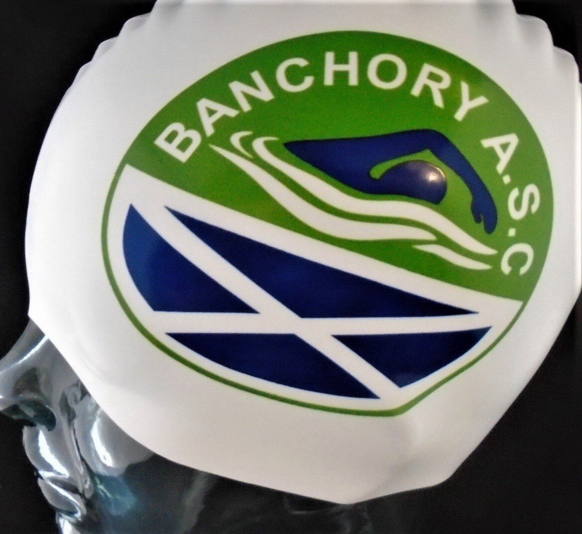 A swimming cap that says banchory a.s.c. on it