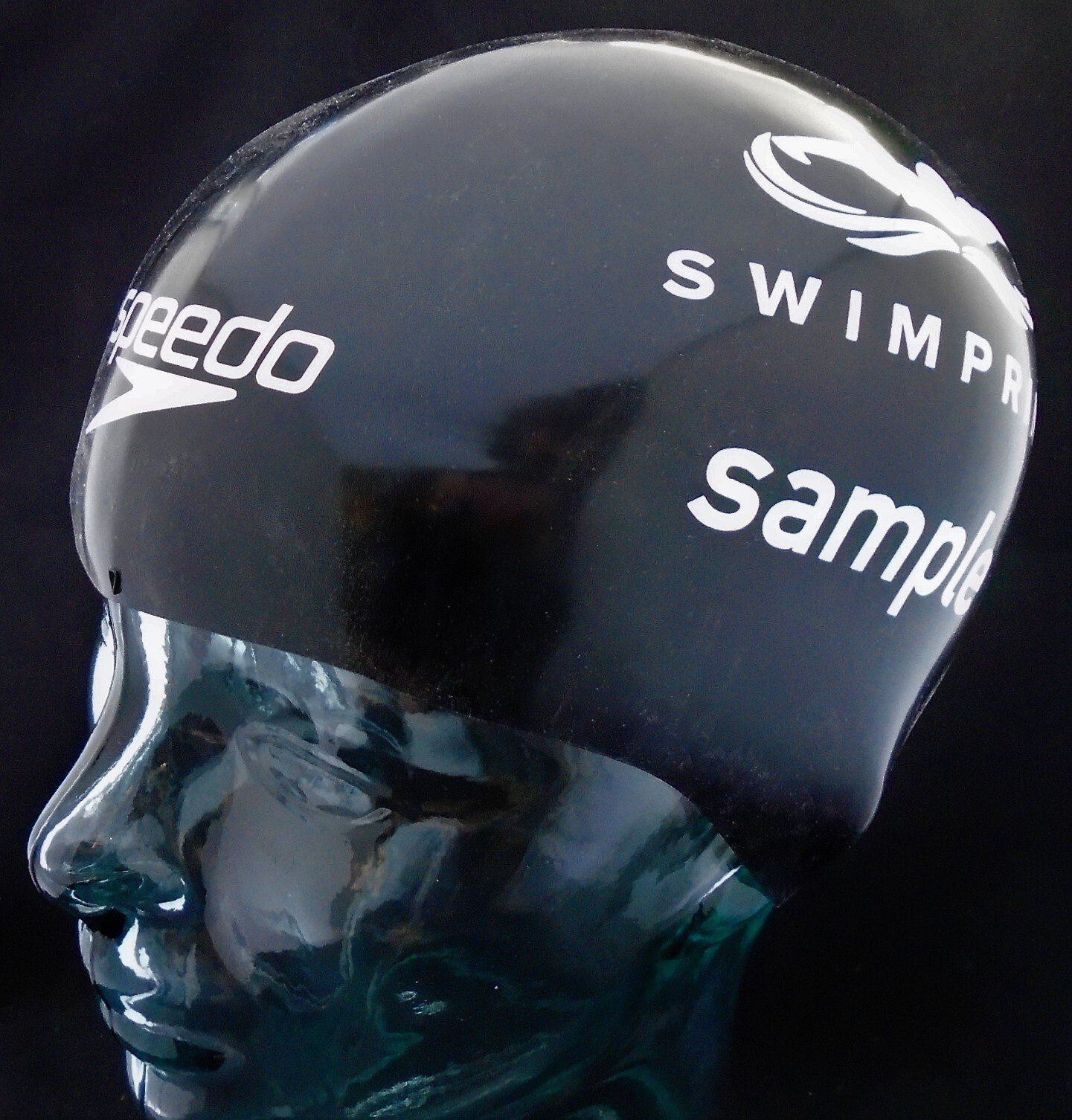 A speedo swim cap is on a mannequin head