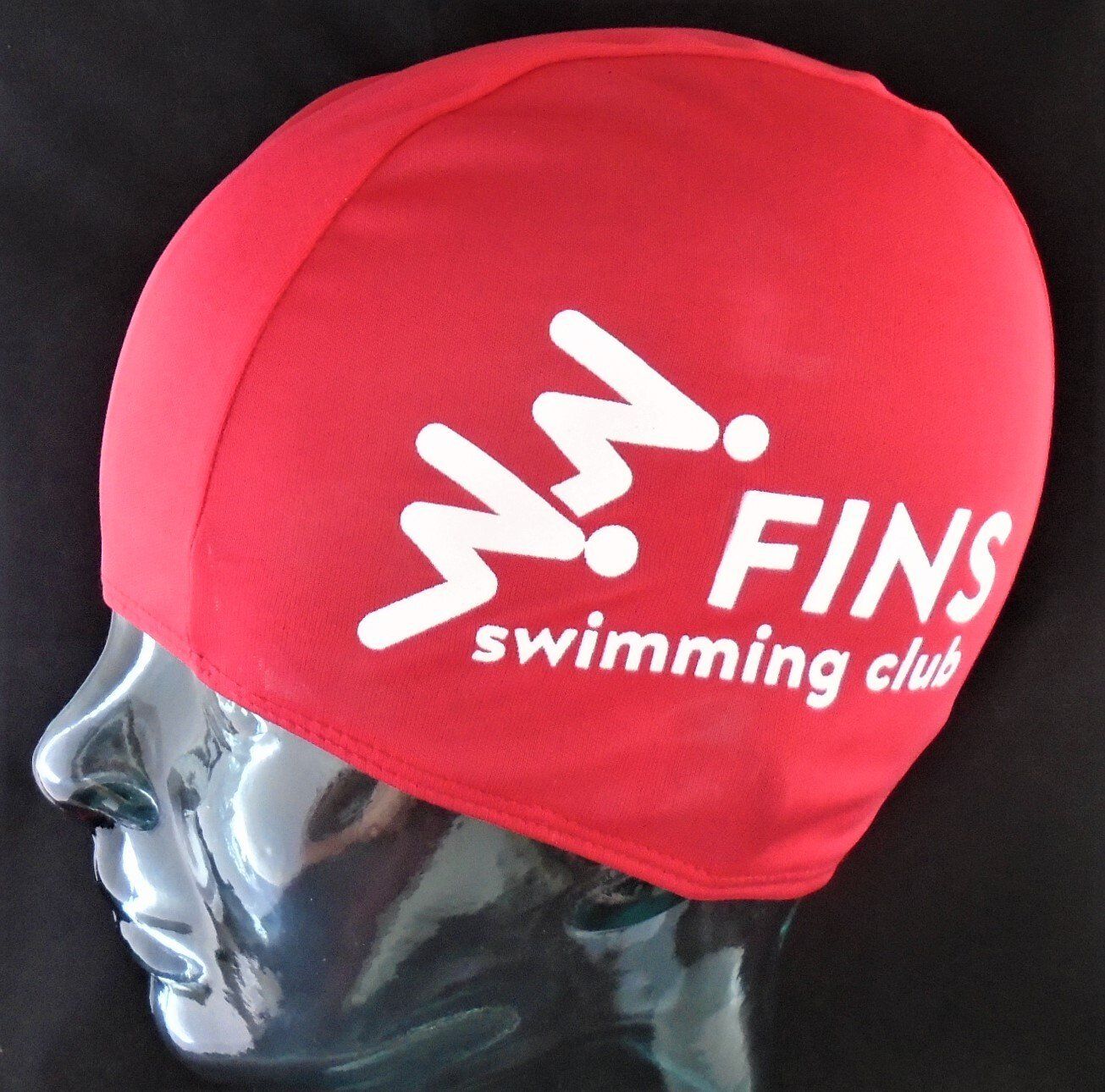 A red swim cap for the fins swimming club