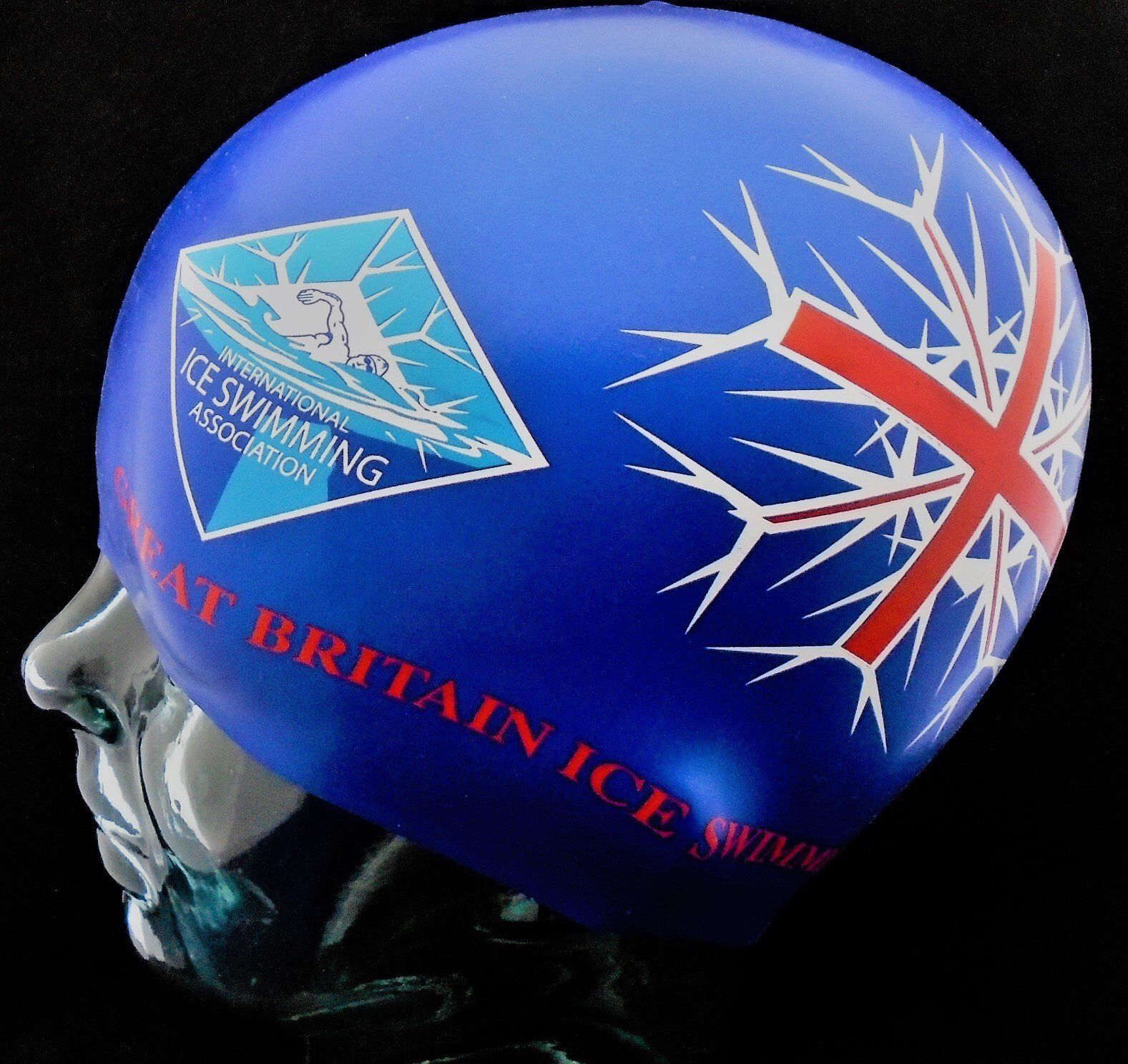 A blue helmet that says great britain ice swimming on it