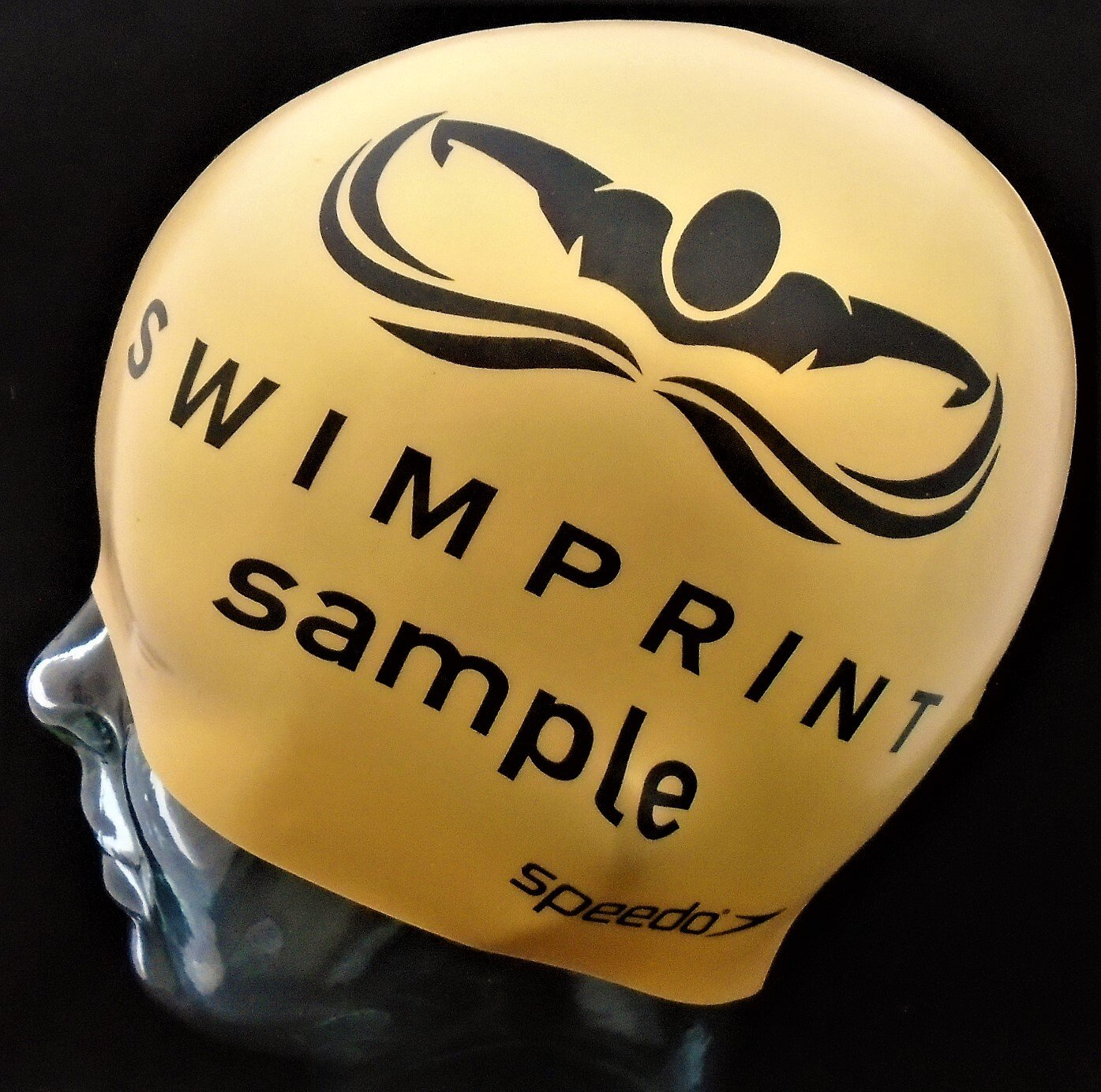 A speedo swim cap that says swimprint sample on it