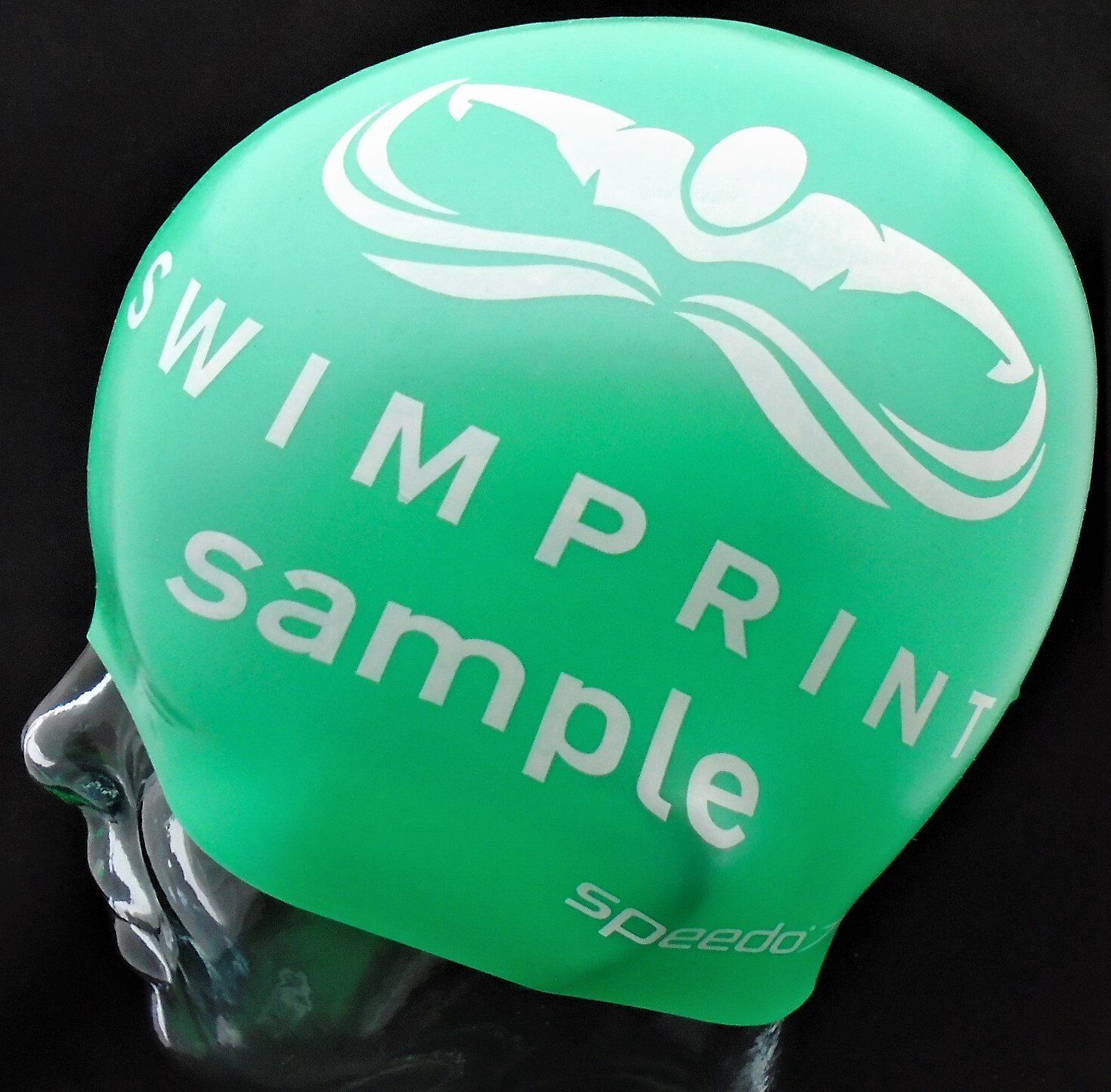 A green swim cap that says swimprint sample on it