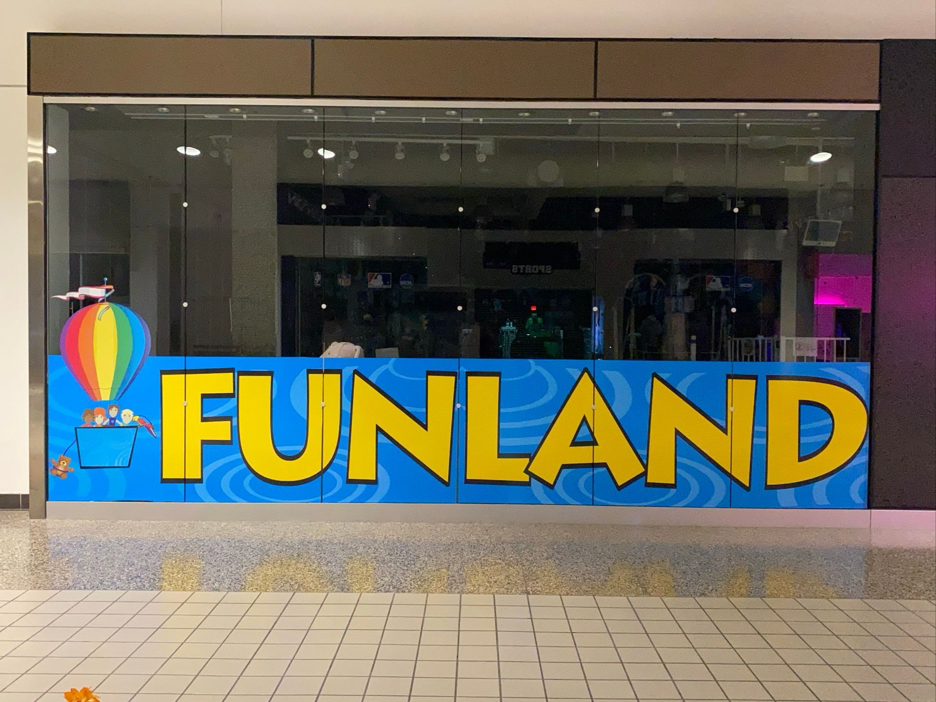 A store called funland is located in a mall.