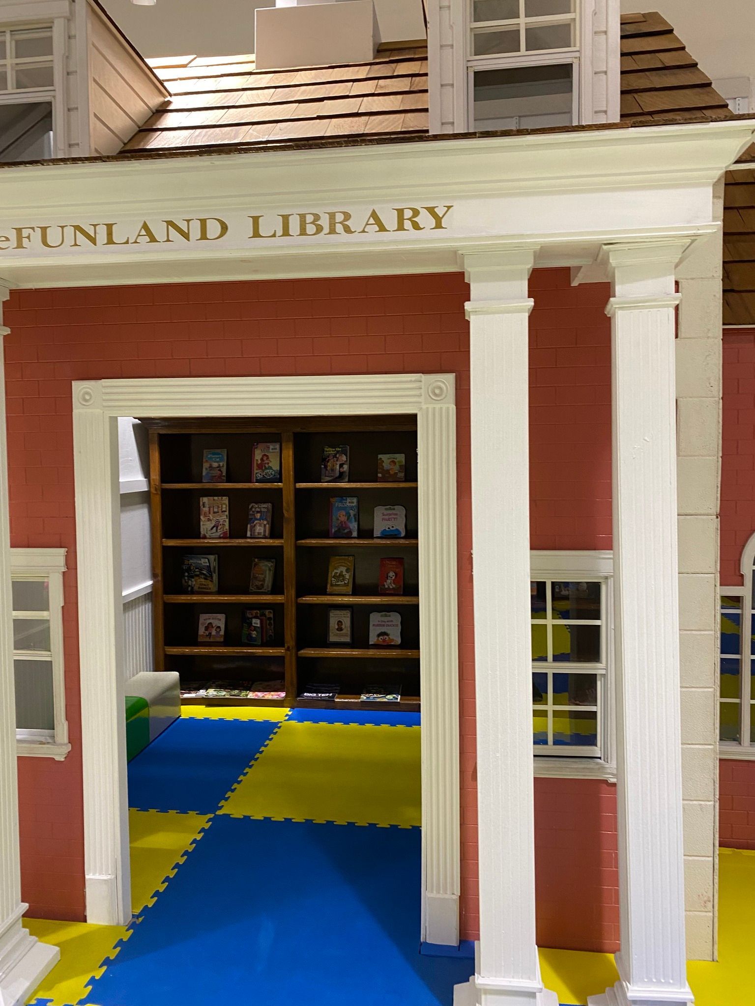 A brick building with a sign that says funland library