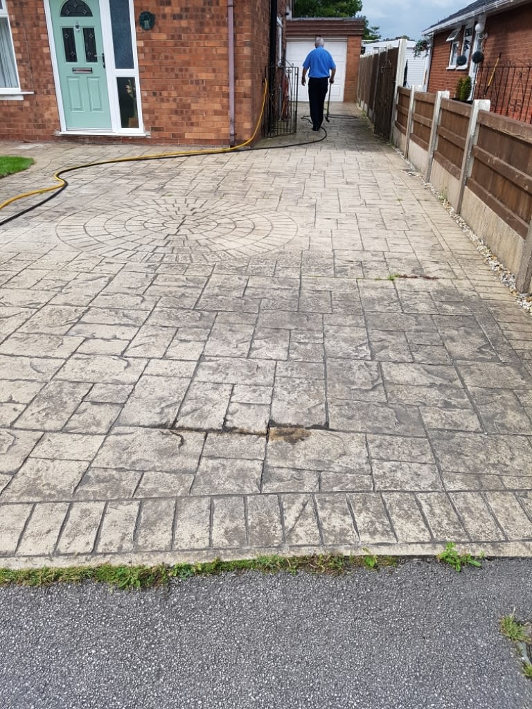 dirty wide paved driveway