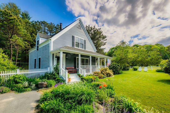 A house with a green front yard. 