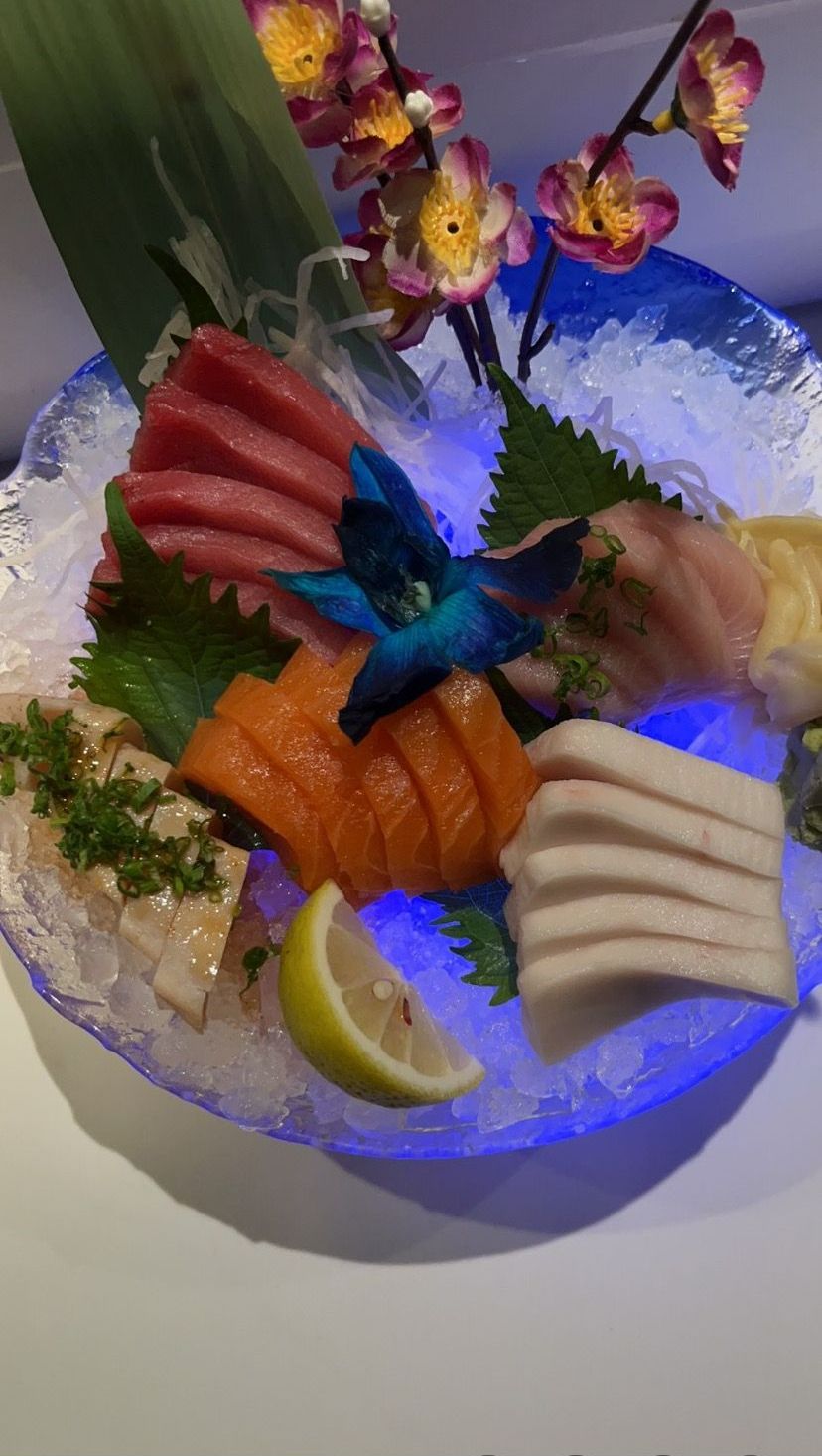 A plate of different sushi variety with a orchids flower on top | Cherry Hill, NJ | Mikado