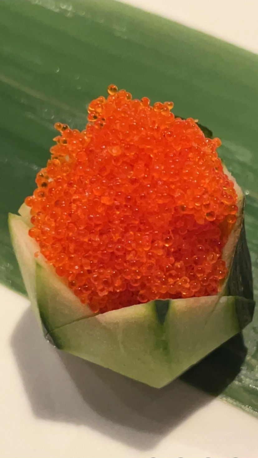 A piece of cucumber with red caviar on top of it | Cherry Hill, NJ | Mikado