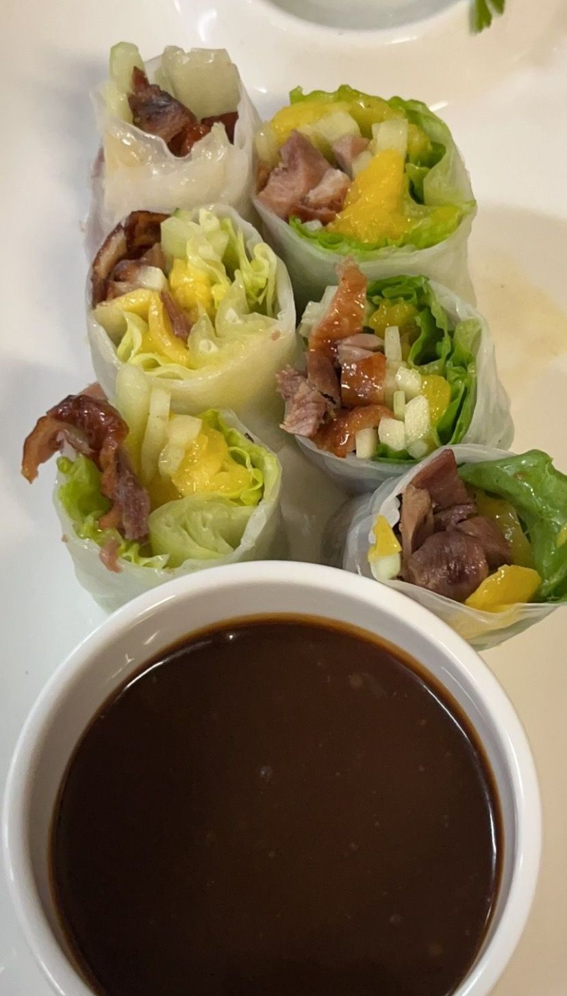 A bowl of dipping sauce sits next to a plate of food | Cherry Hill, NJ | Mikado