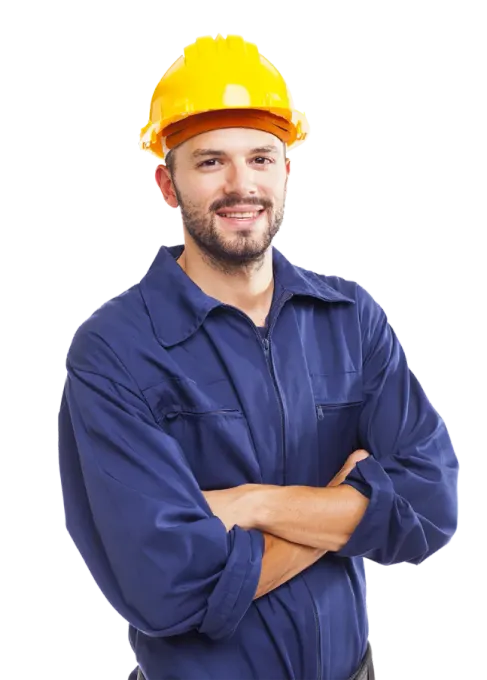 A man wearing a hard hat is standing with his arms crossed