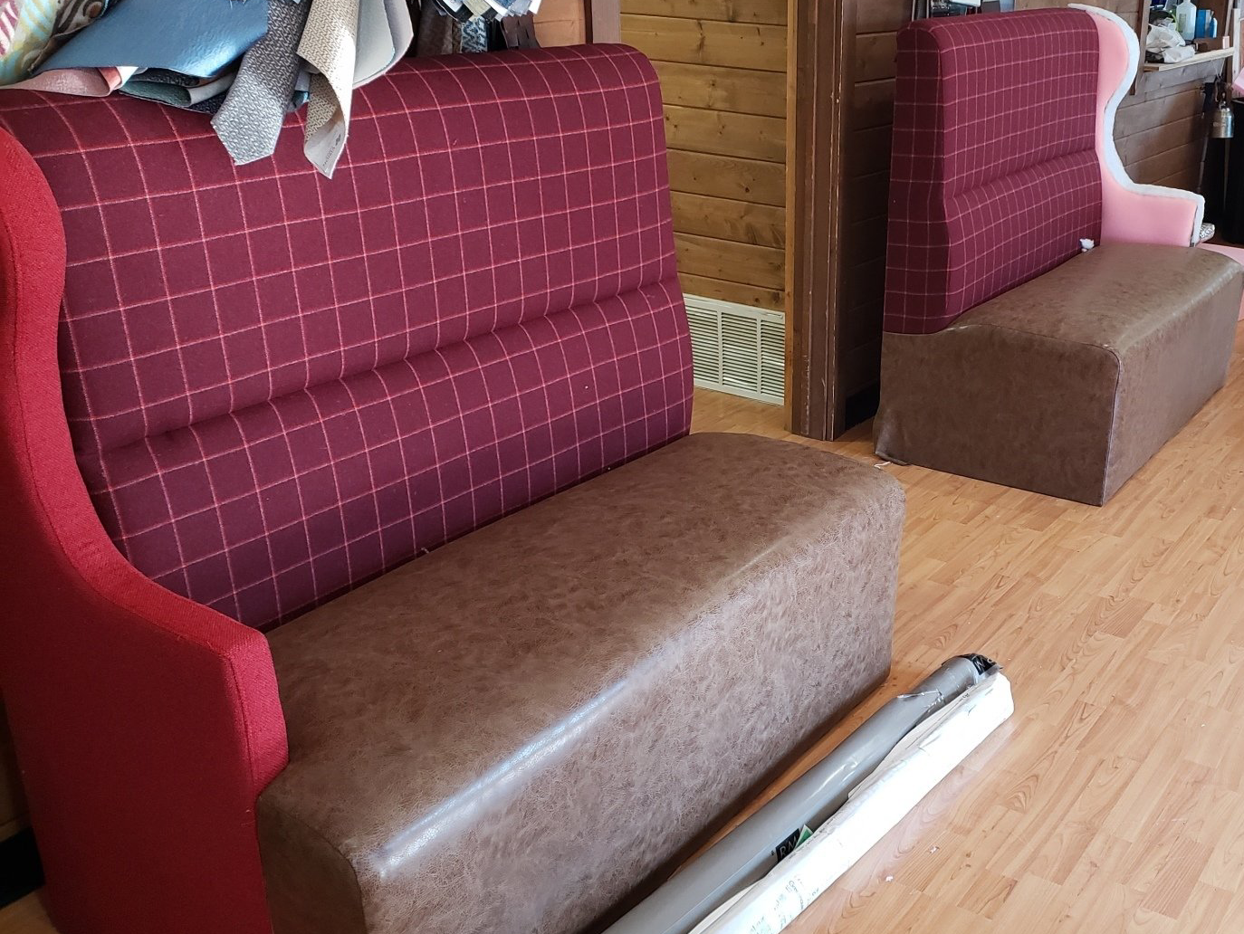 A red and brown couch with a checkered pattern