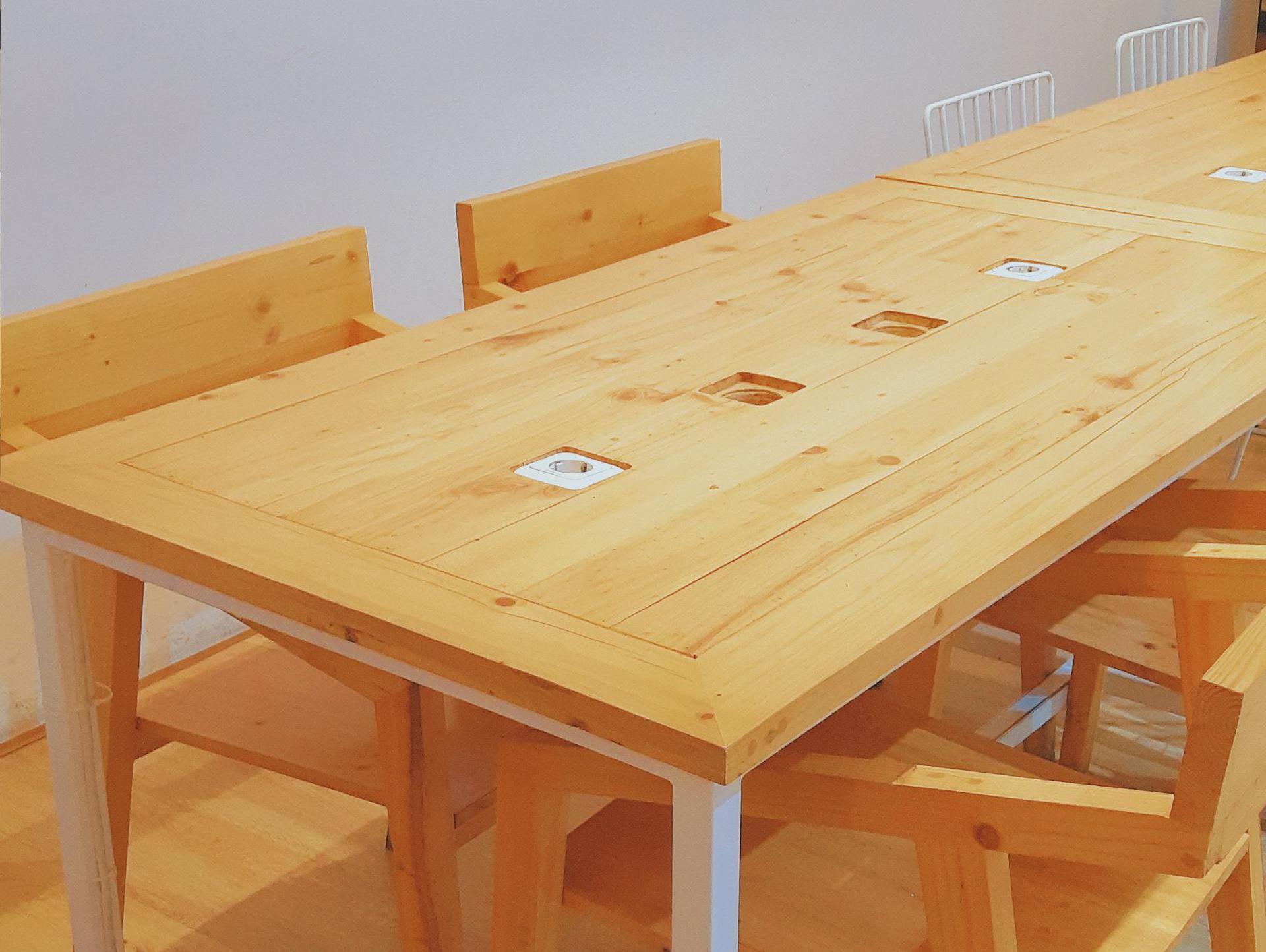 A wooden table and chairs in a room