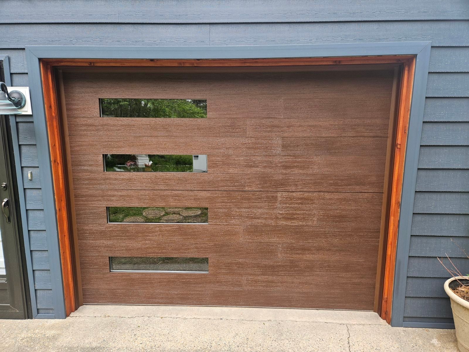The garage door is made of wood and has a wooden frame.