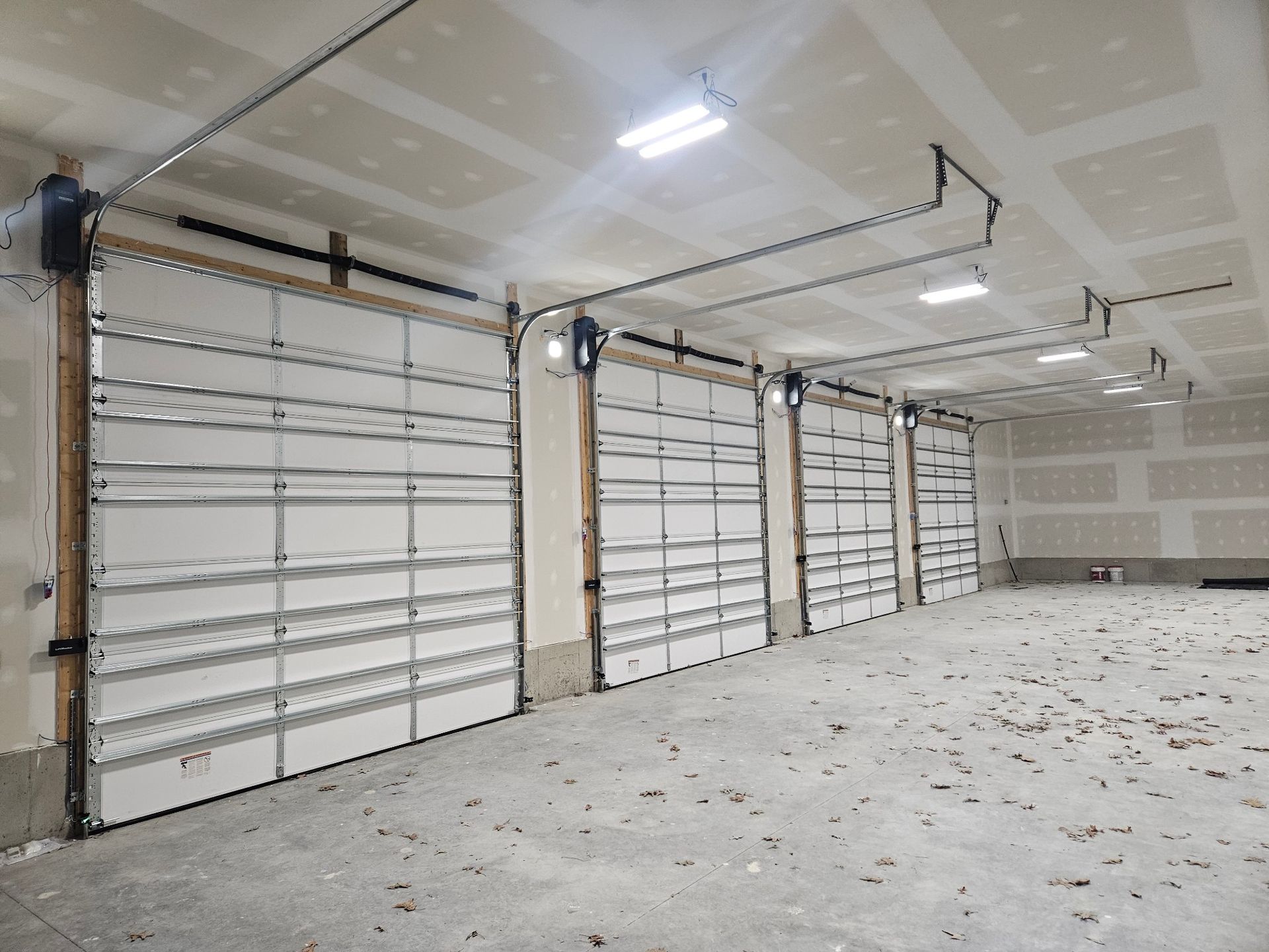 An empty garage with a lot of garage doors open
