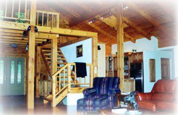 Commercial Remodeling — Contemporary Custom Log Home With Sofa And Stairs in Haven, PA