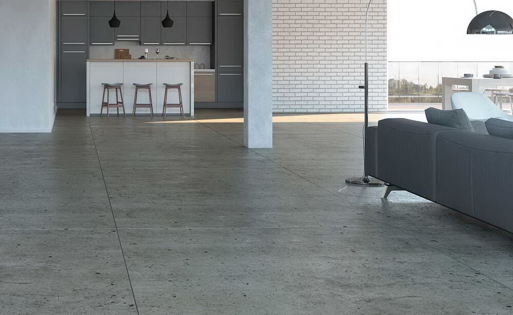 A worker seamlessly joins vinyl floor covering during a home renovation, ensuring a smooth and cohesive appearance.