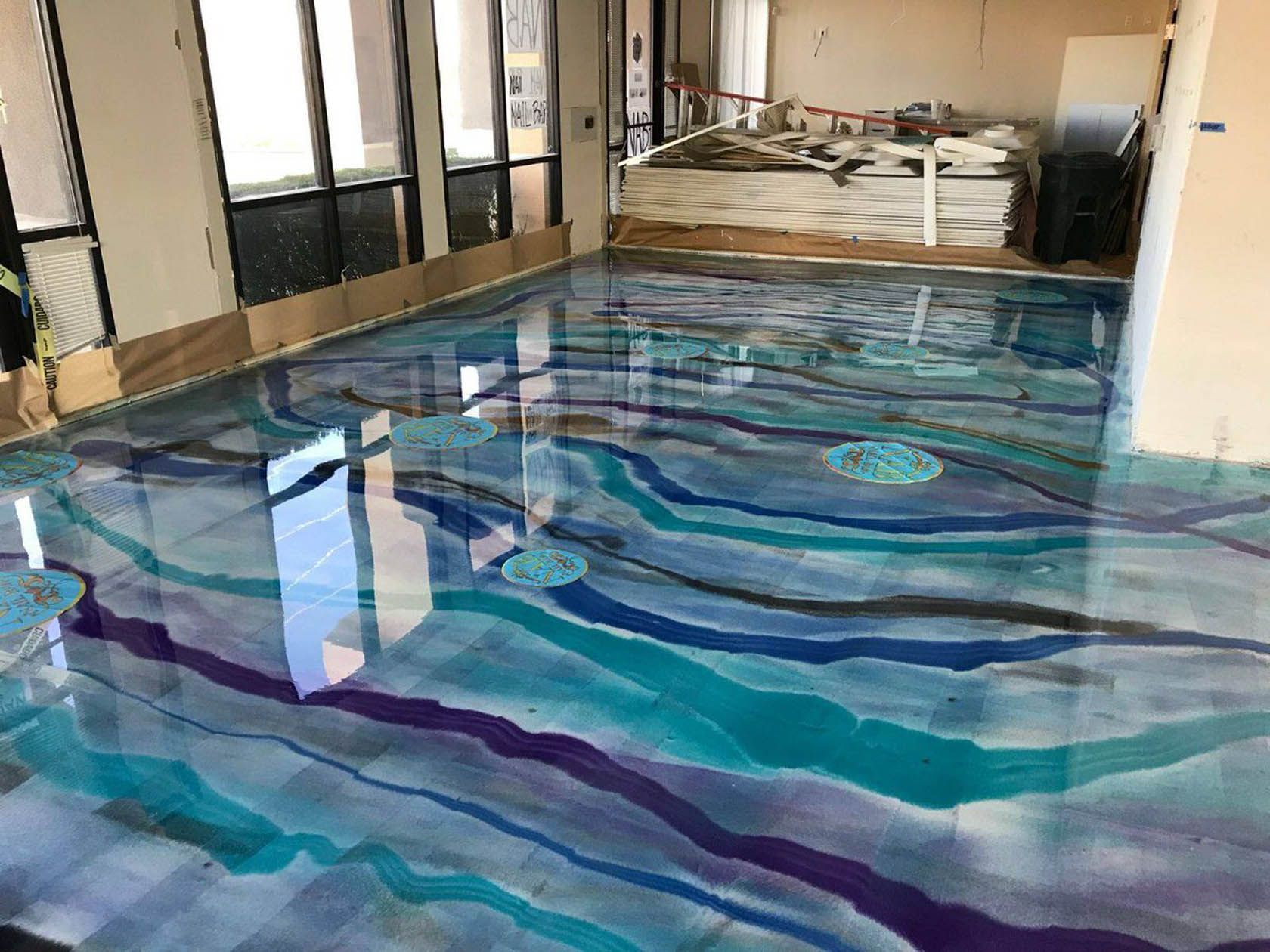 A worker seamlessly joins vinyl floor covering during a home renovation, ensuring a smooth and cohesive appearance.