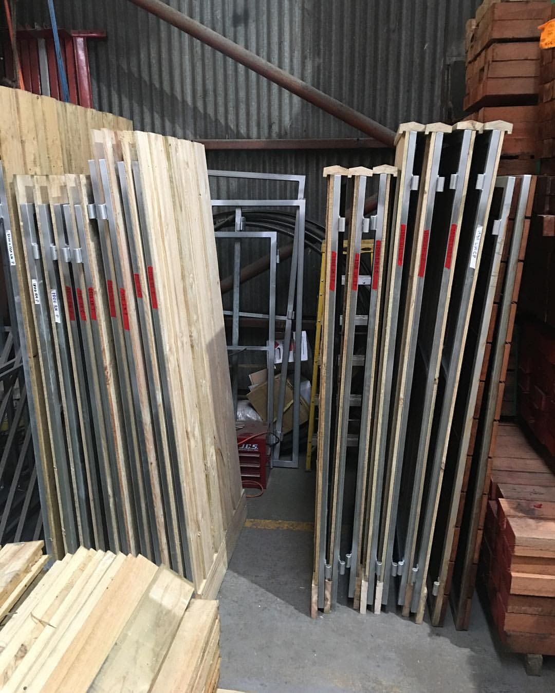 Stacks of Wooden Scaffold Planks and Metal Supports in a Storage Area — Trade Fencing Supplies in Moolap, VIC