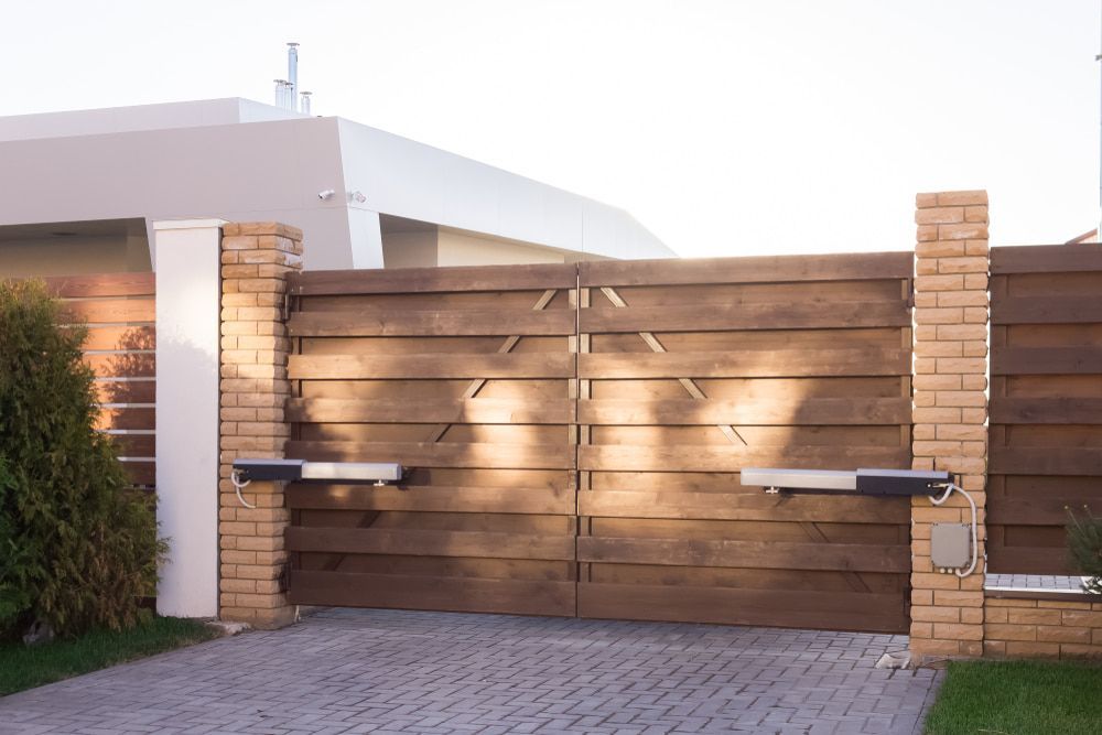 Wooden Driveway Gate With Brick Columns — Trade Fencing Supplies in Moolap, VIC