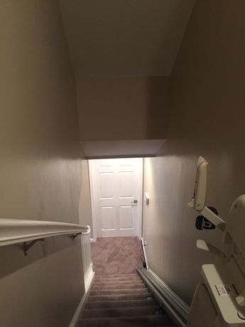 Finished Staircase with fresh carpet and freshly painted walls, view from top of stairs in Miramar Beach, Florida