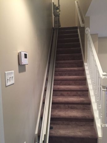 Finished Staircase with fresh carpet and freshly painted walls, view from bottom of stairs in Miramar Beach, Florida