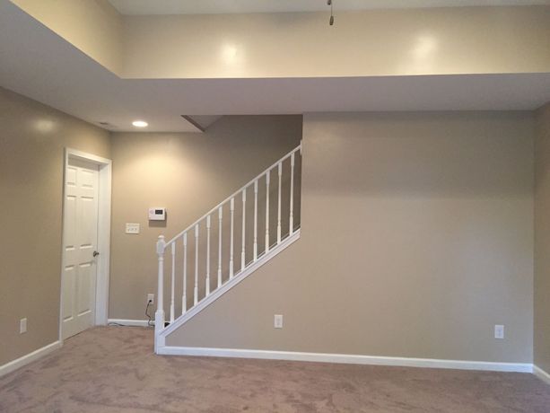 finished drywall & paint job accompanied by a delicate white handrail after water damage took place located in Miramar Beach, Florida