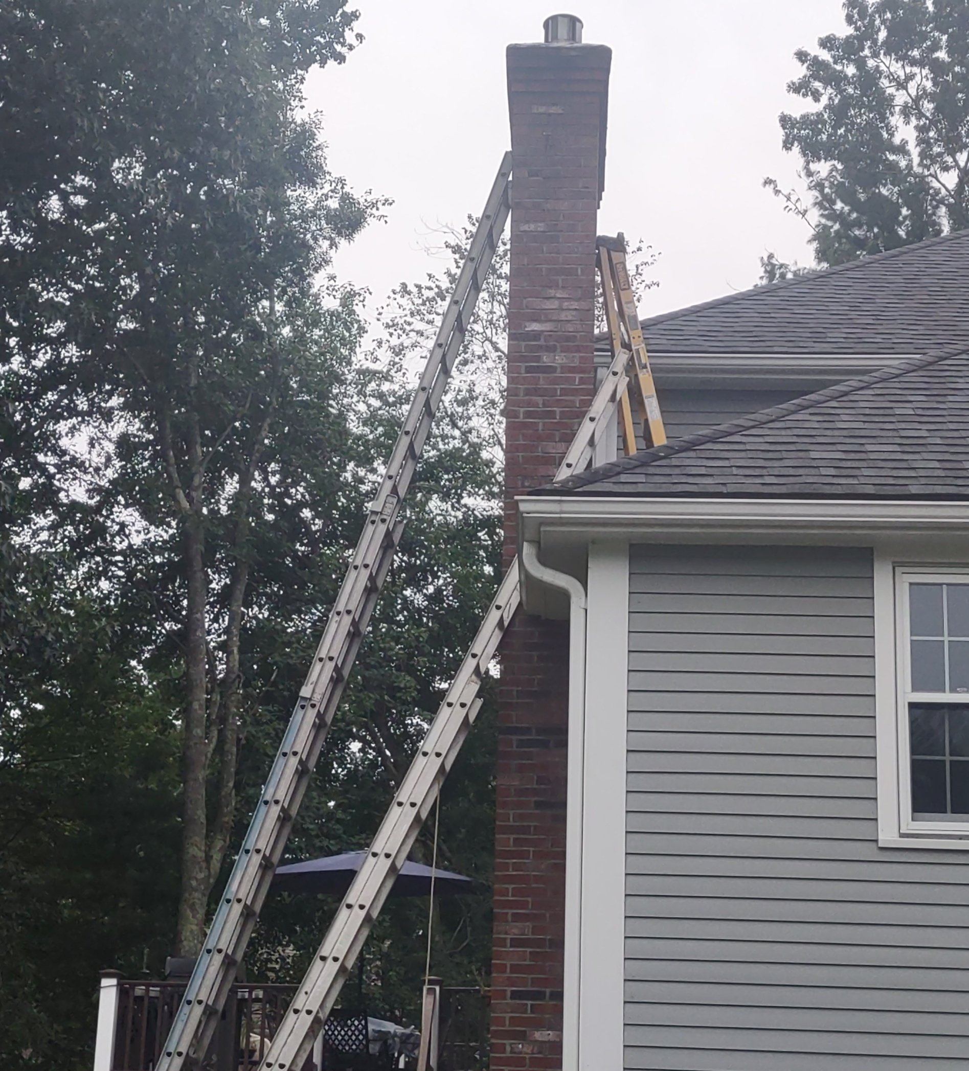 chimney cleaning ladder setup