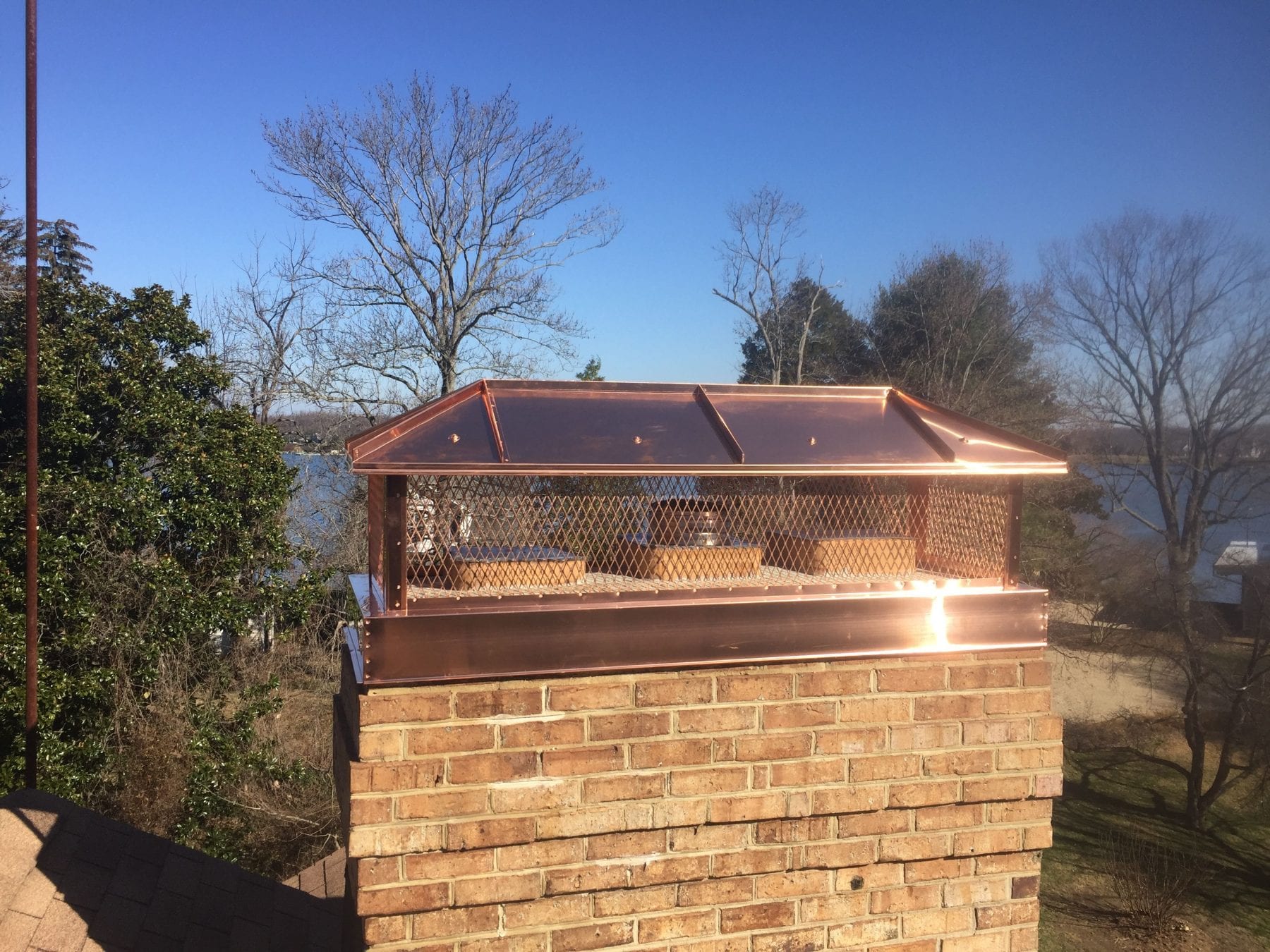new steel chimney cap installed on new chimney in Concord, MA