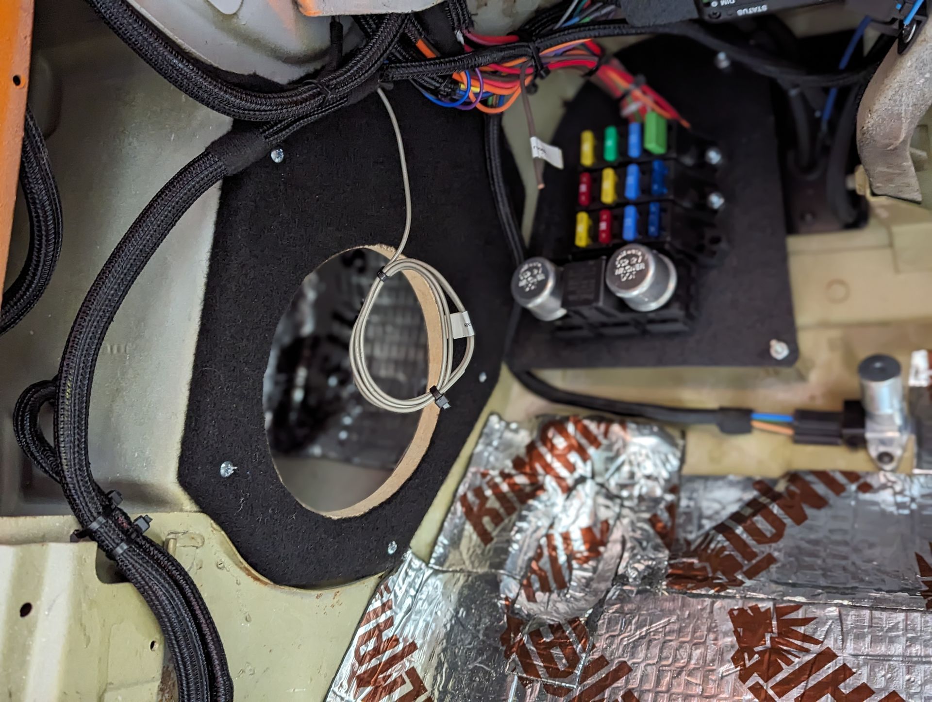 A close up of a fuse box in a car