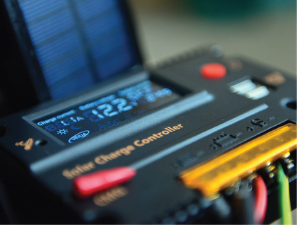 A solar charge controller is sitting on a table