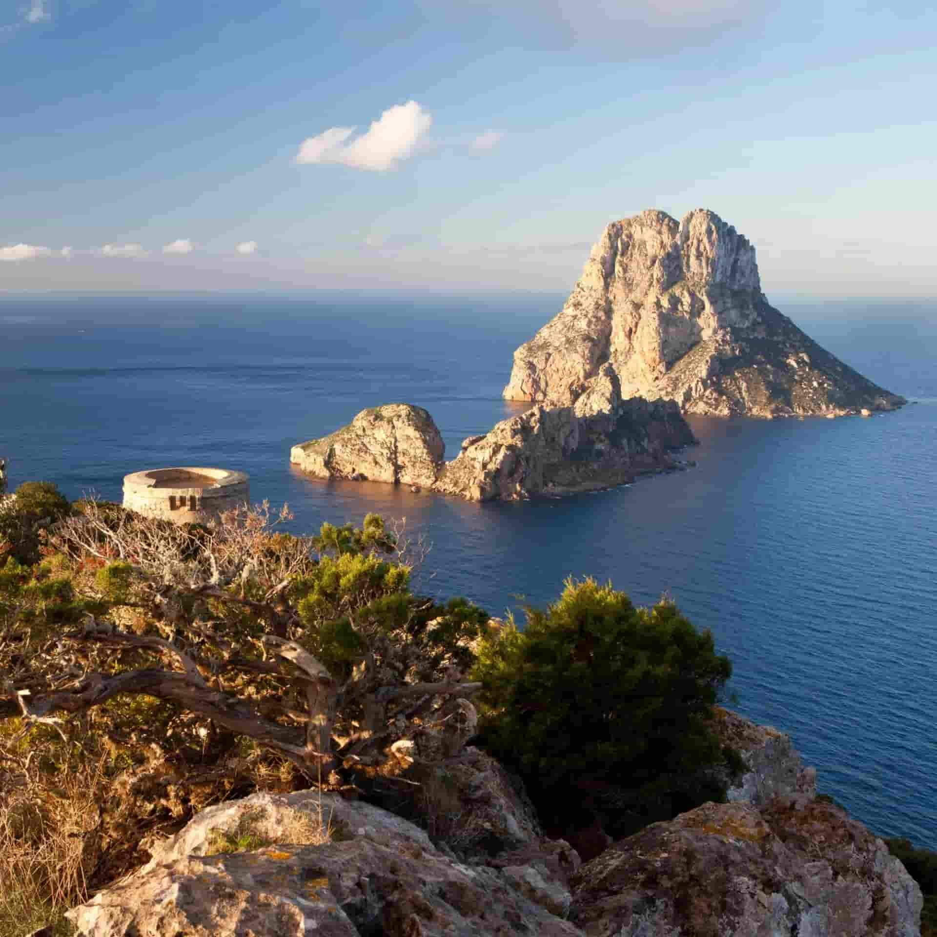 A large rocky island in the middle of the ocean