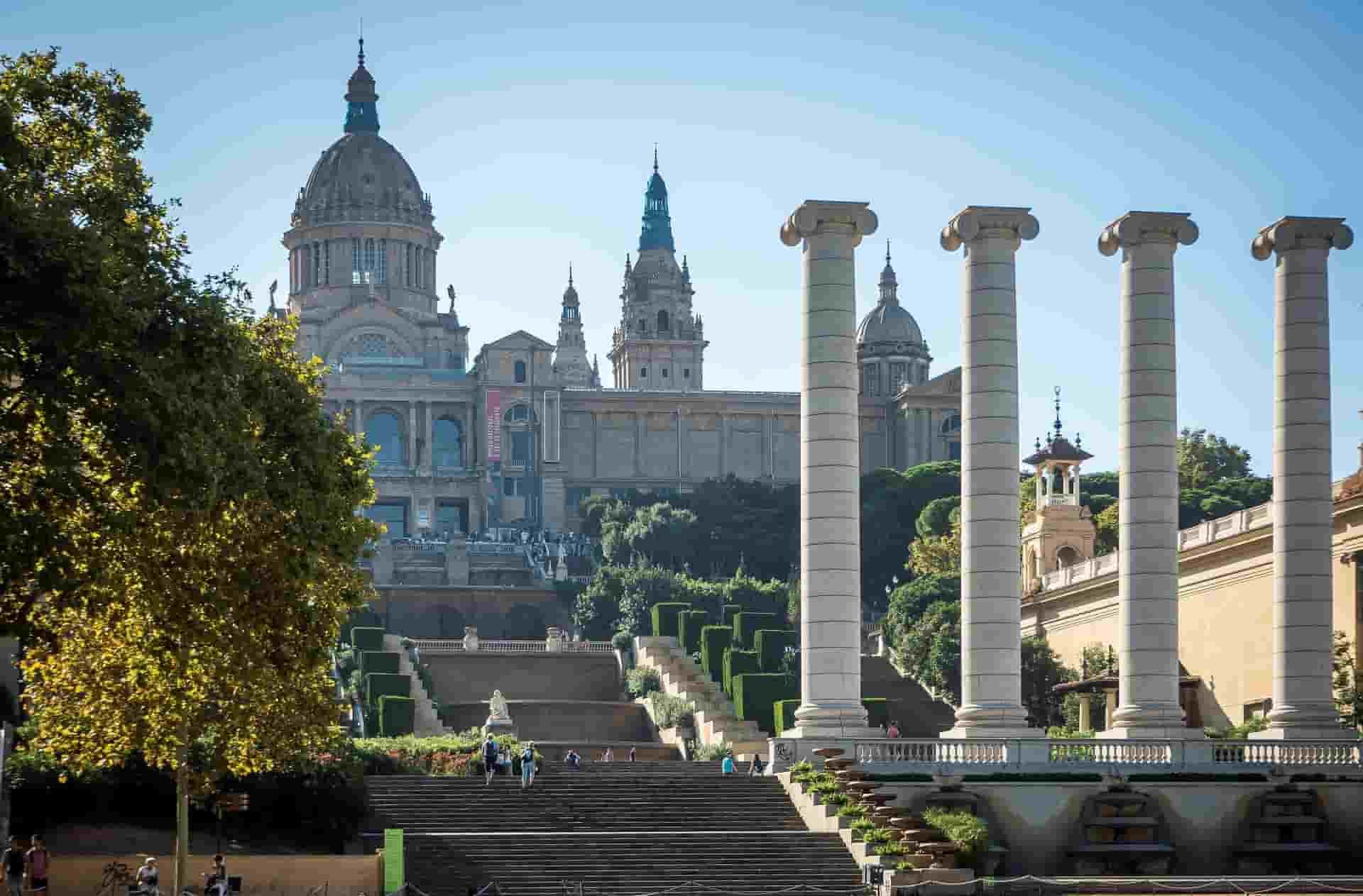 A row of columns in front of a large building in Barcelona