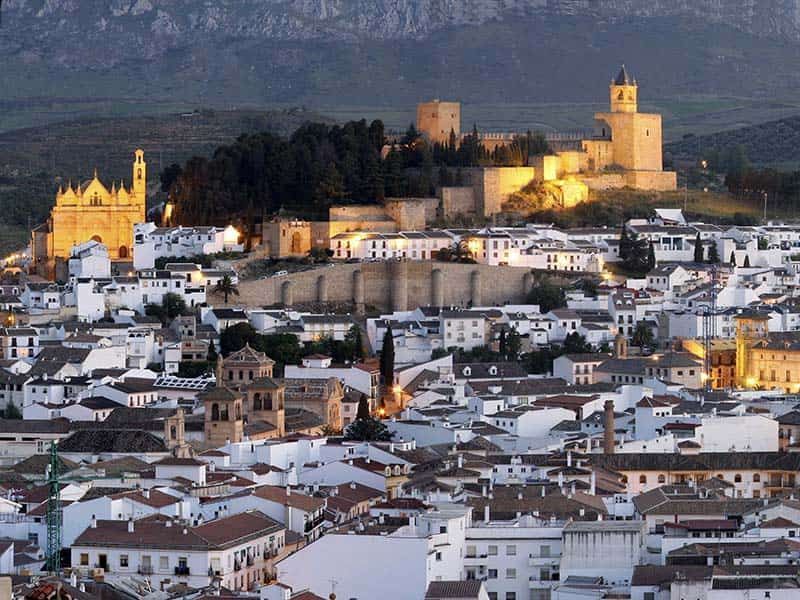 An aerial view of Antequera with a castle in the background