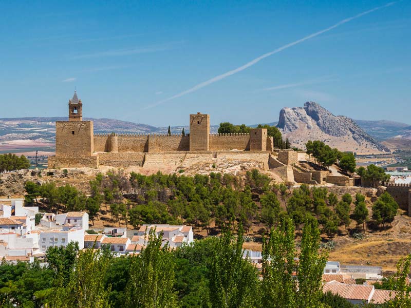 An aerial view of Antequera with a castle in the background