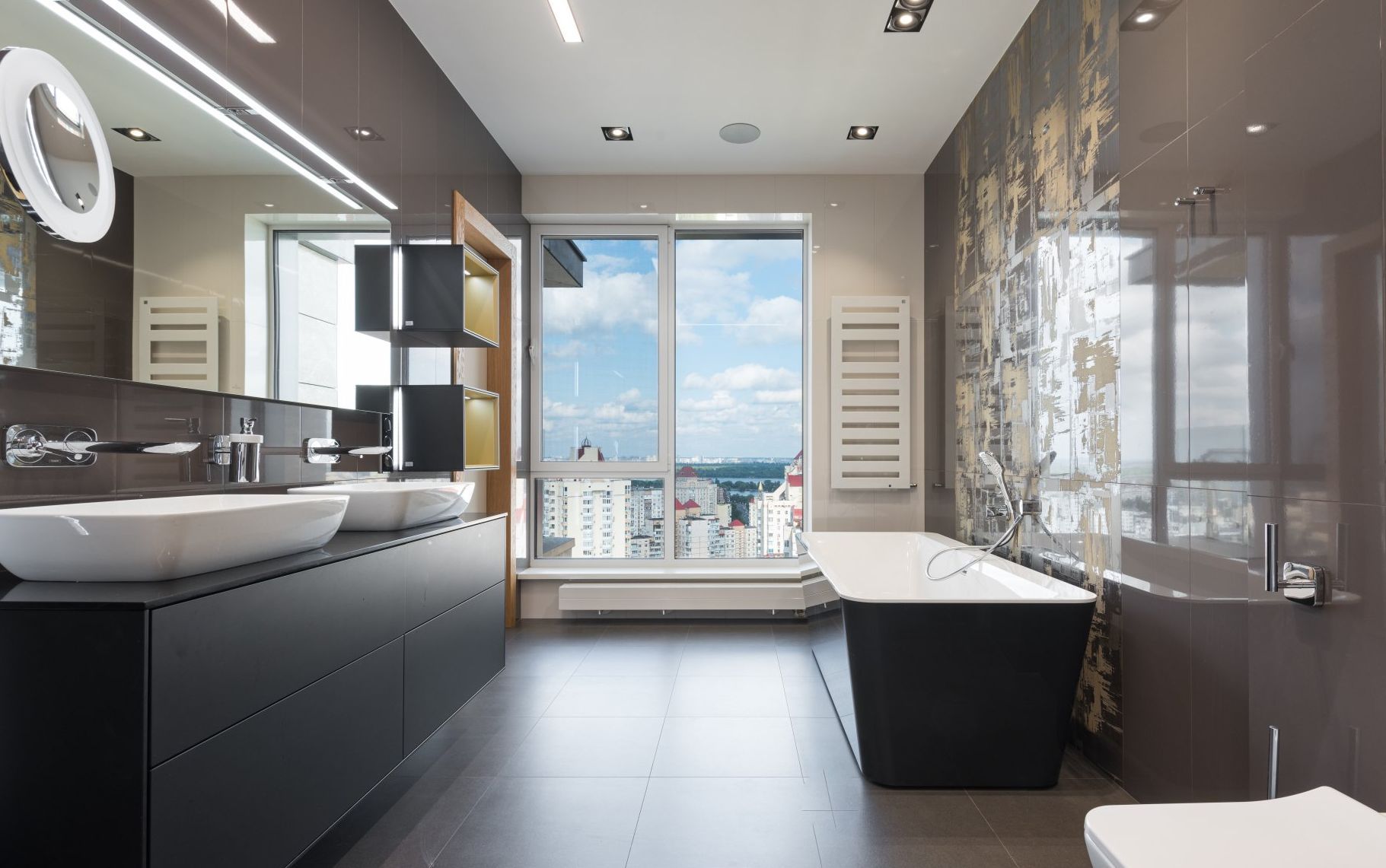 picture of a well-designed bathroom with a window view of the city