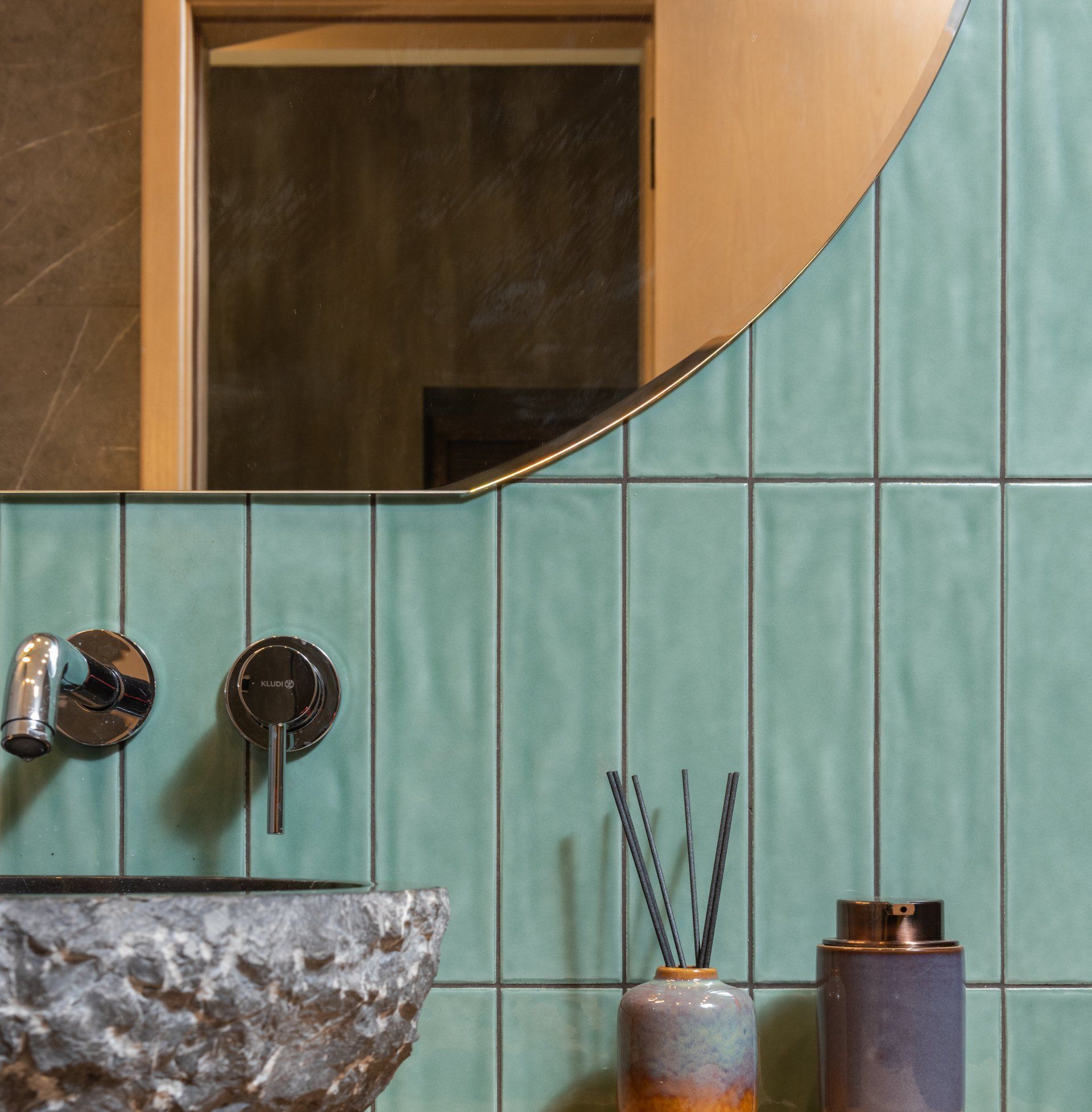 picture of green large tiles on bathroom wall