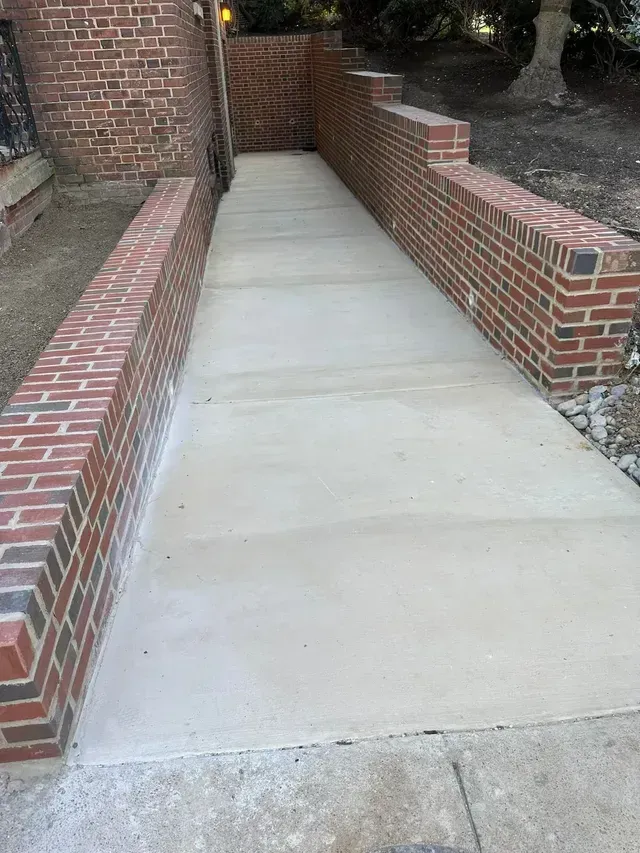 A red color wall brick and white concrete