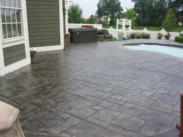 stamped concrete job results around pool area in maryland