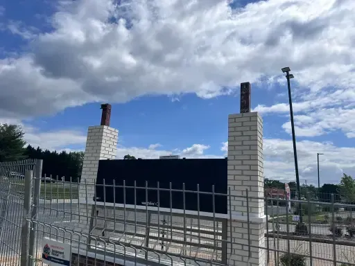 Masonry concrete restoration of new commercial brick pillars.