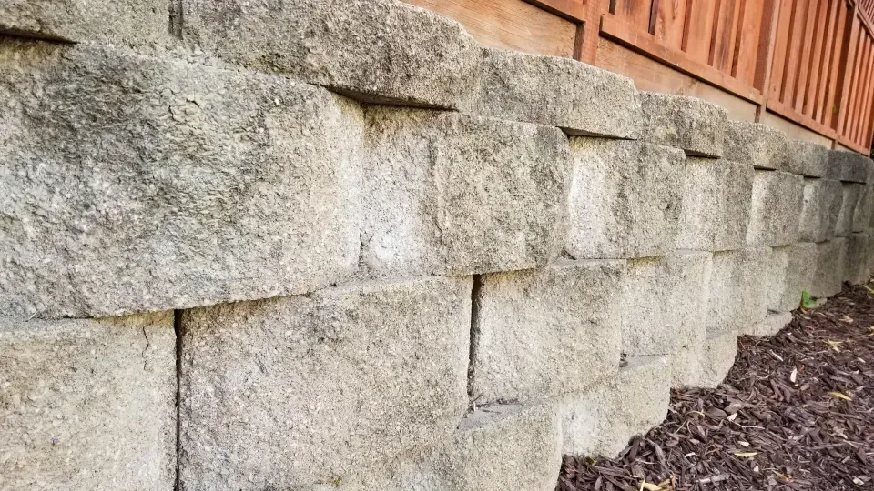 Exterior wall repair services for weathered block retaining walls