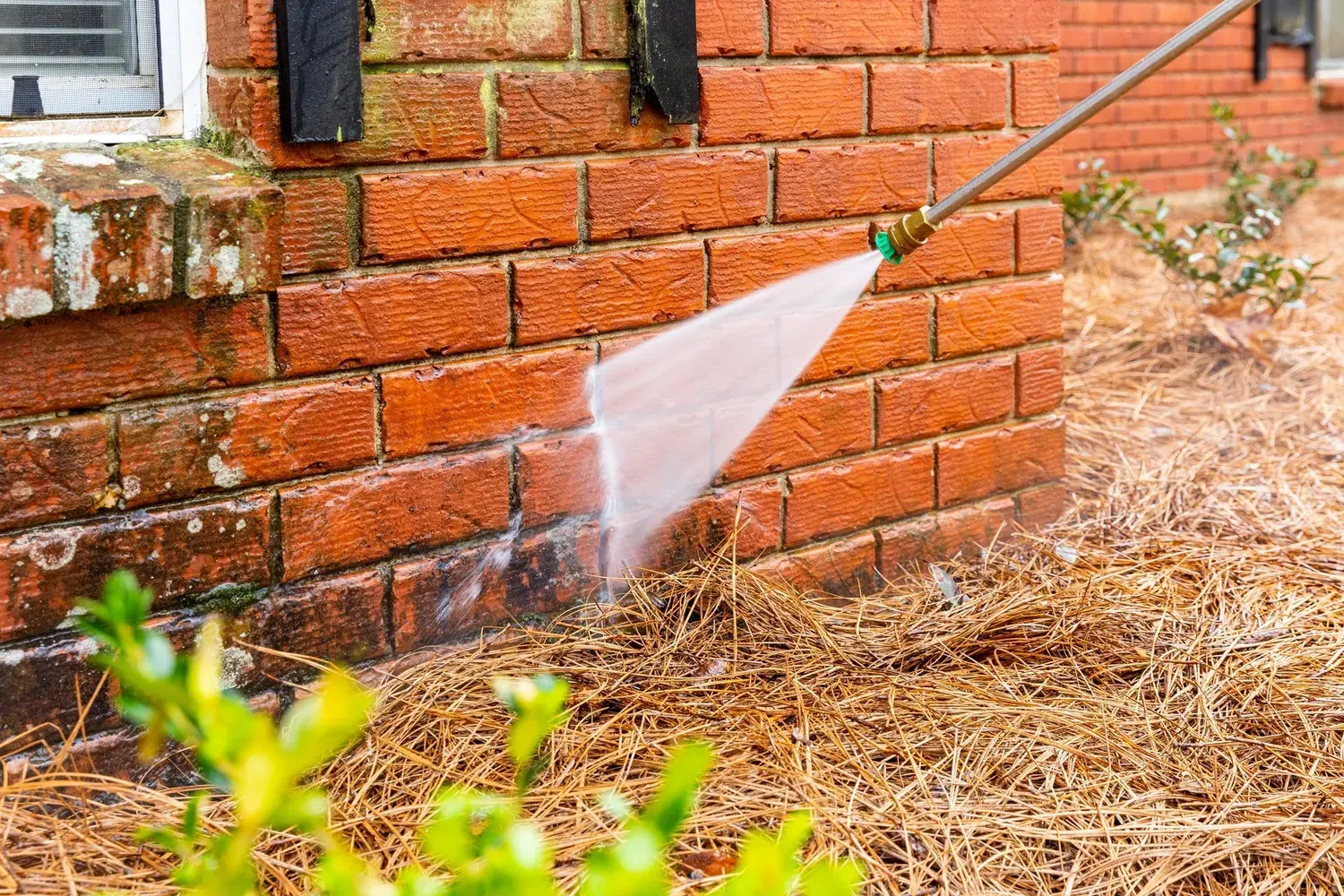 Pressure washer cleaning a concrete surface.