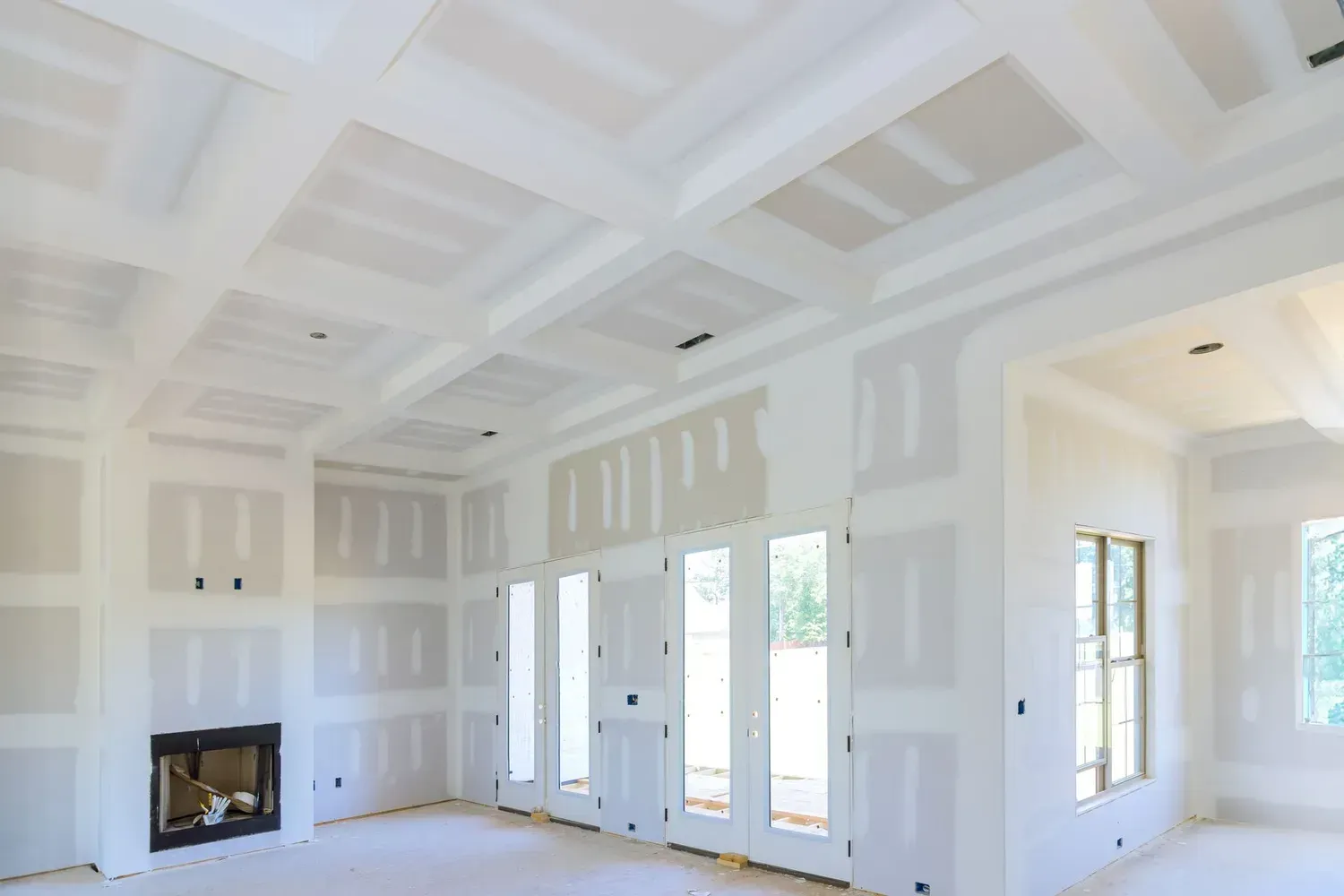 Room under construction, drywall walls, doorway, unfinished.