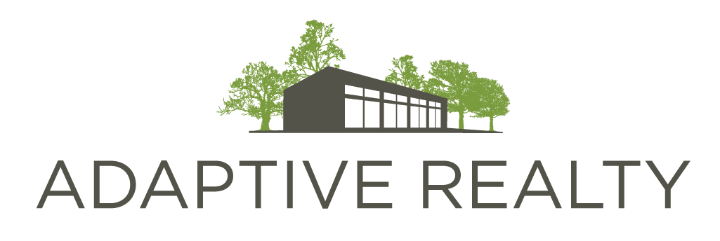A logo for a real estate company called adaptive realty
