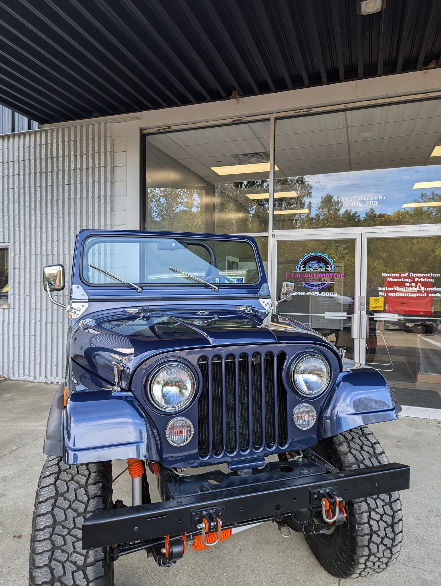 An aerial view of a large wave in the ocean.