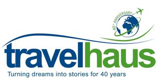 The travelhaus logo has a globe and an airplane on it.