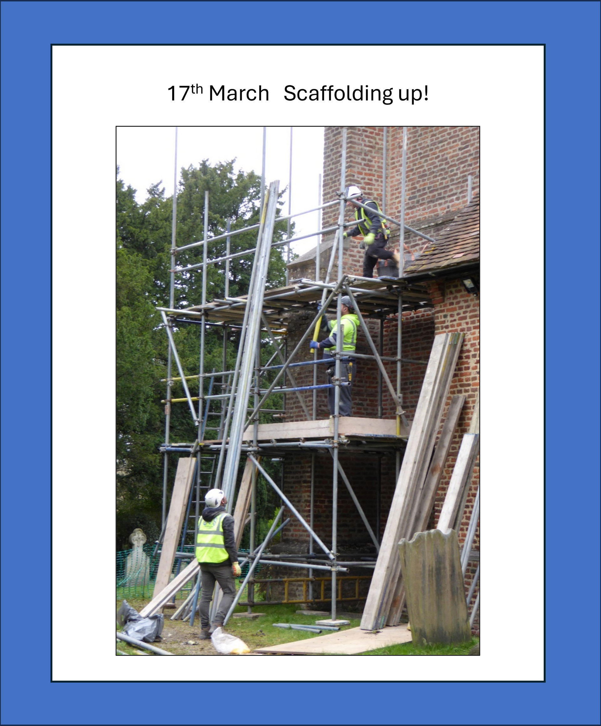 Scaffolding erected on a brick building with workers in safety vests.