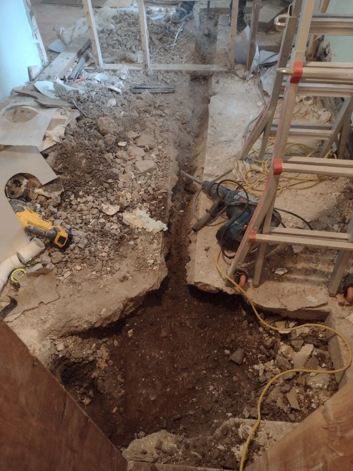 Trench dug for new bathroom layout