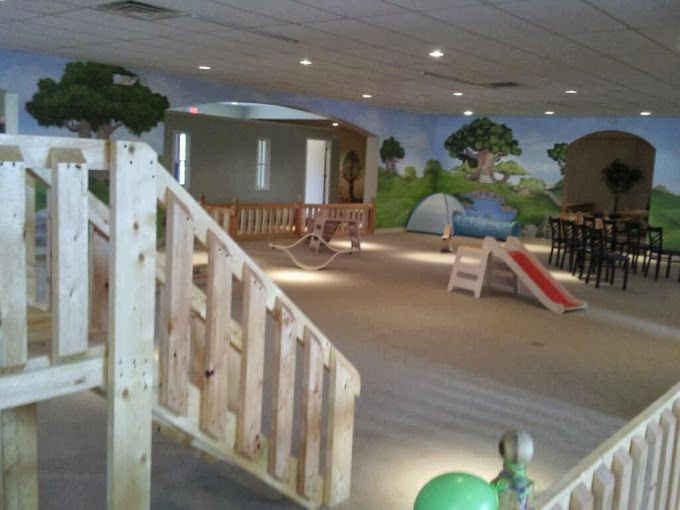 A large room with stairs and a slide