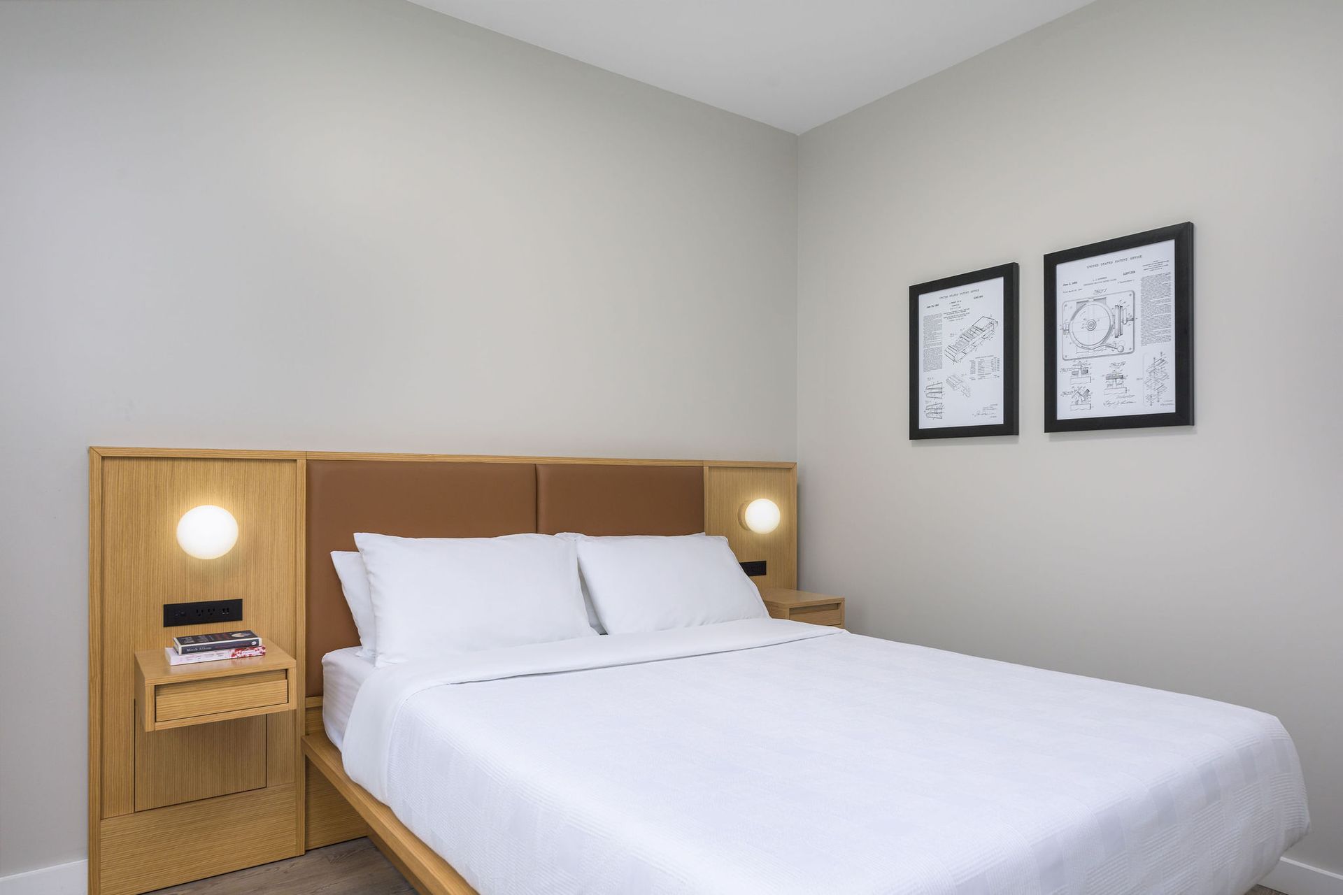 A hotel room with a king size bed and two nightstands.