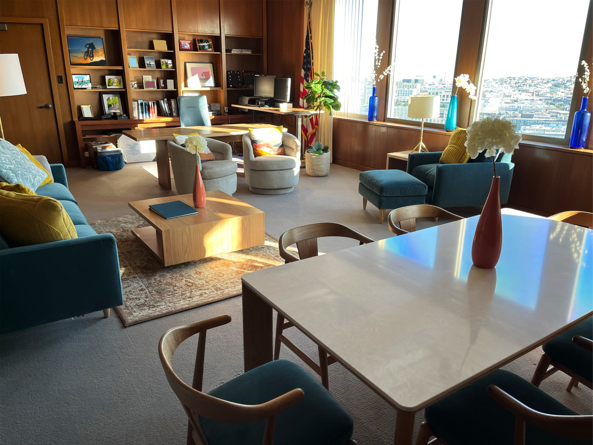 A living room with a table and chairs and a couch